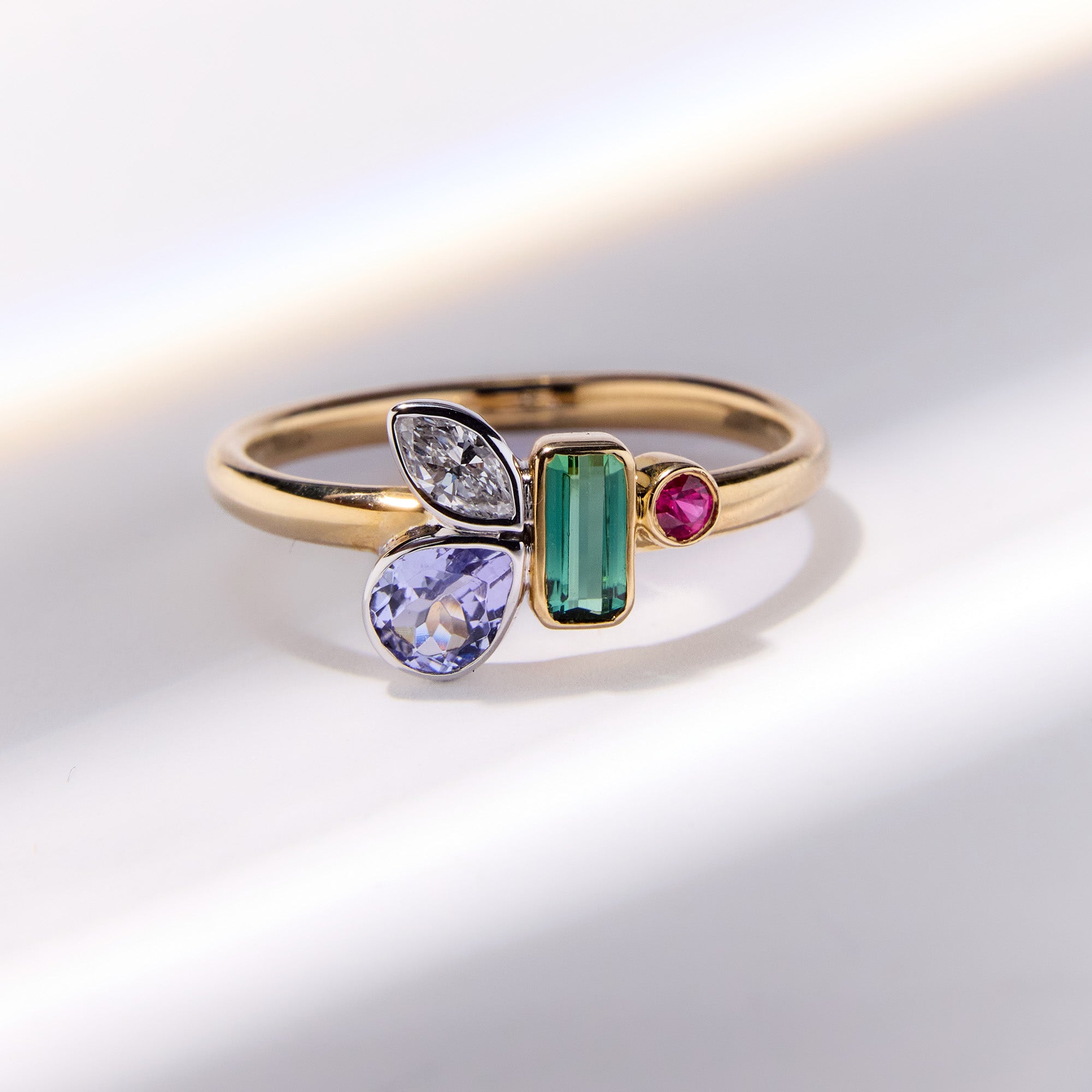 Birthstone bouquet ring with green tourmaline, amethyst, diamond and ruby cluster