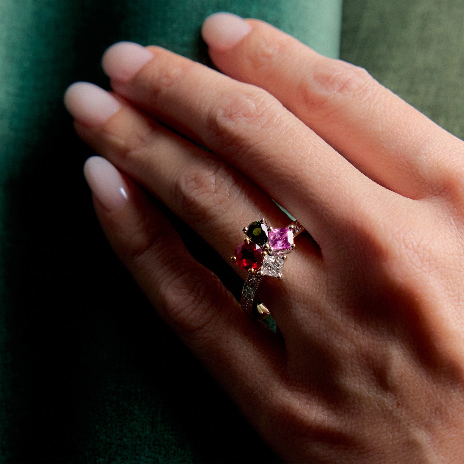 Ring with multicolored gemstone bouquet in 18k yellow gold, worn on hand