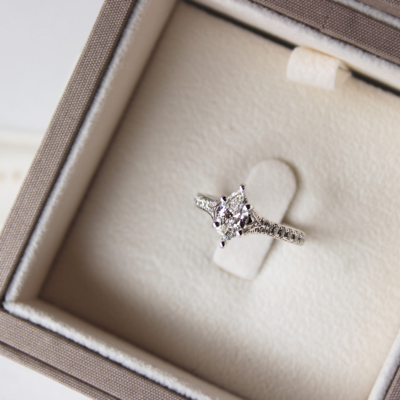 Elegant Marquise Split Band Diamond Ring in white gold, featuring centre marquise diamond and sparkling shoulder accents.