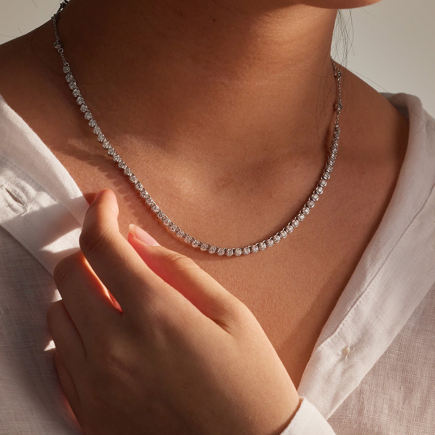 FJ Diamond Tennis Necklace with 3.00 carats of natural white diamonds set in 18k white gold, designed for everyday elegance and comfort. Worn on model.