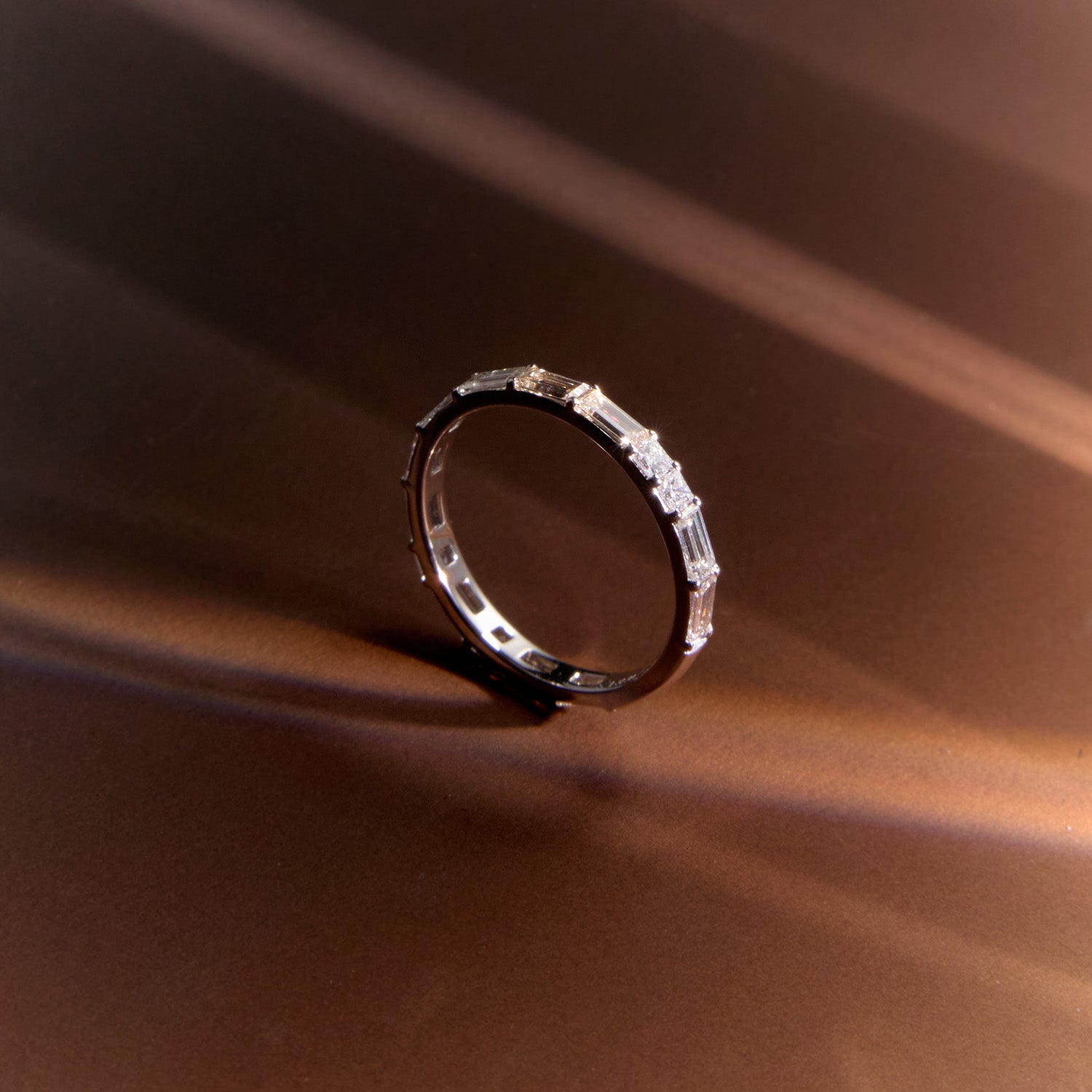 18k white gold Morse code ring featuring diamonds spelling family initials, a modern wedding band.