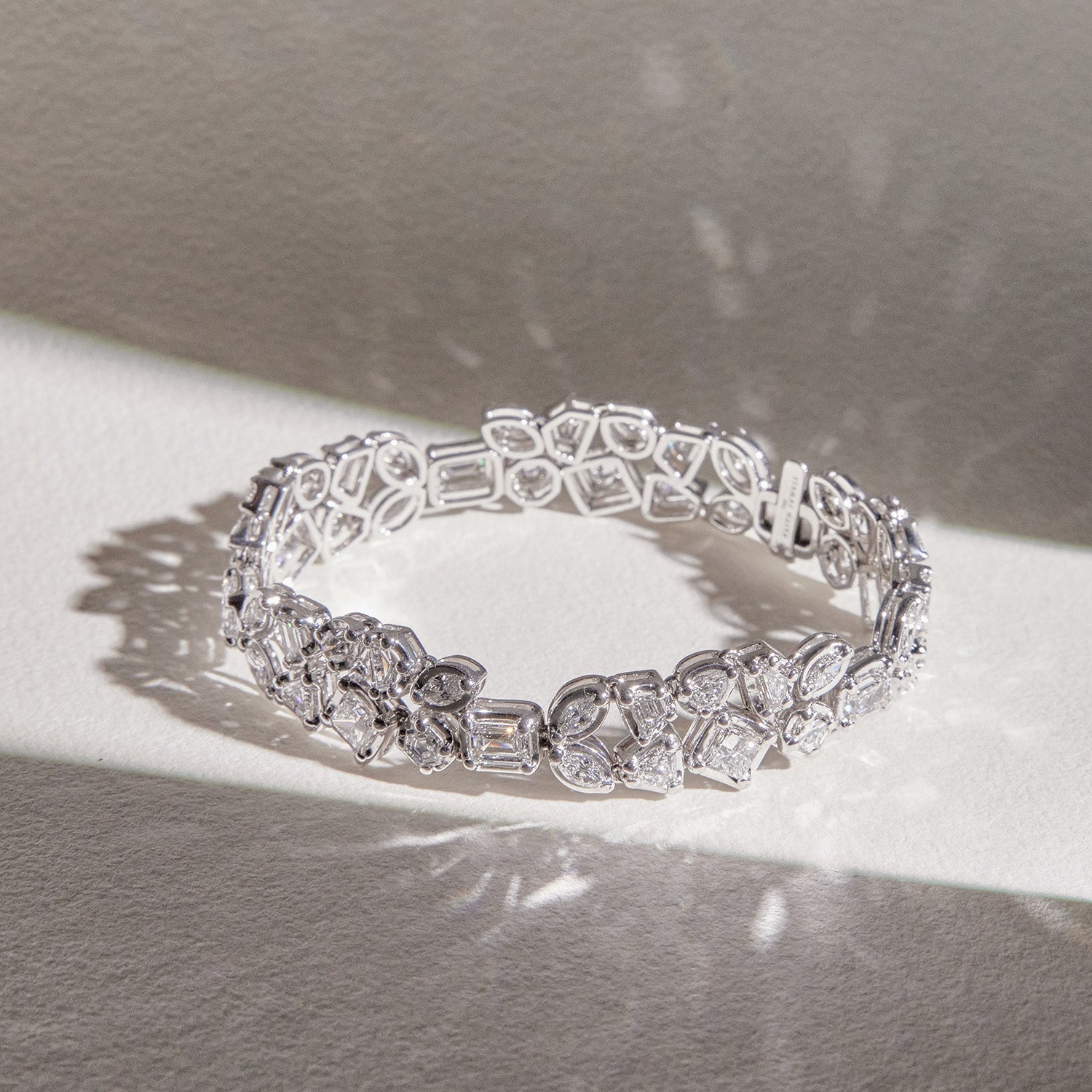 Faith Jewels Bouquet Diamond Bracelet featuring a mix of Marquis, Pear, Hexagon, Shield, Trapezoid, Epaulette, Emerald, and Princess-cut diamonds totaling 10.10 carats