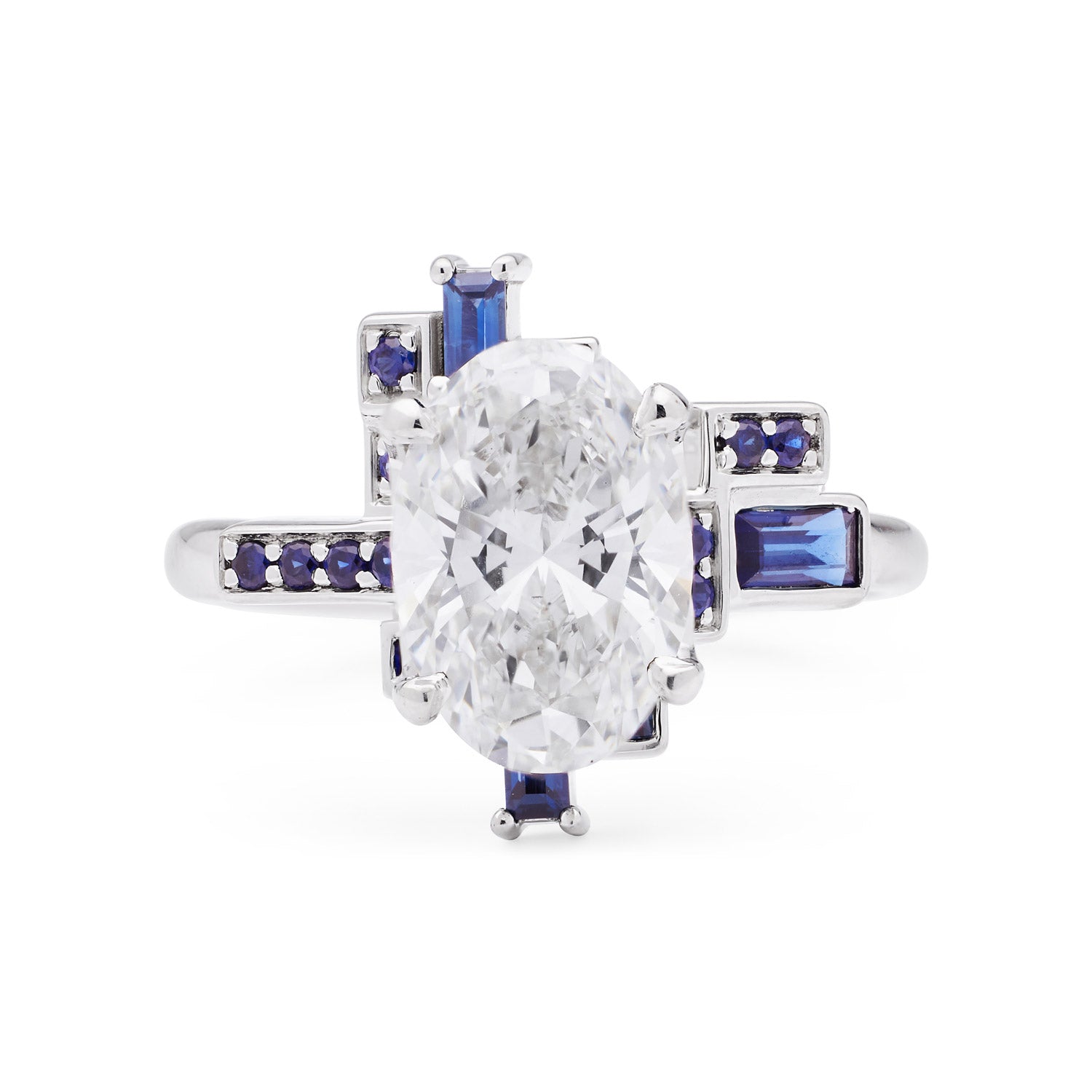 Faith Jewels Skyline Oval Diamond Ring featuring a 2ct oval-cut diamond surrounded by baguette and round blue sapphires