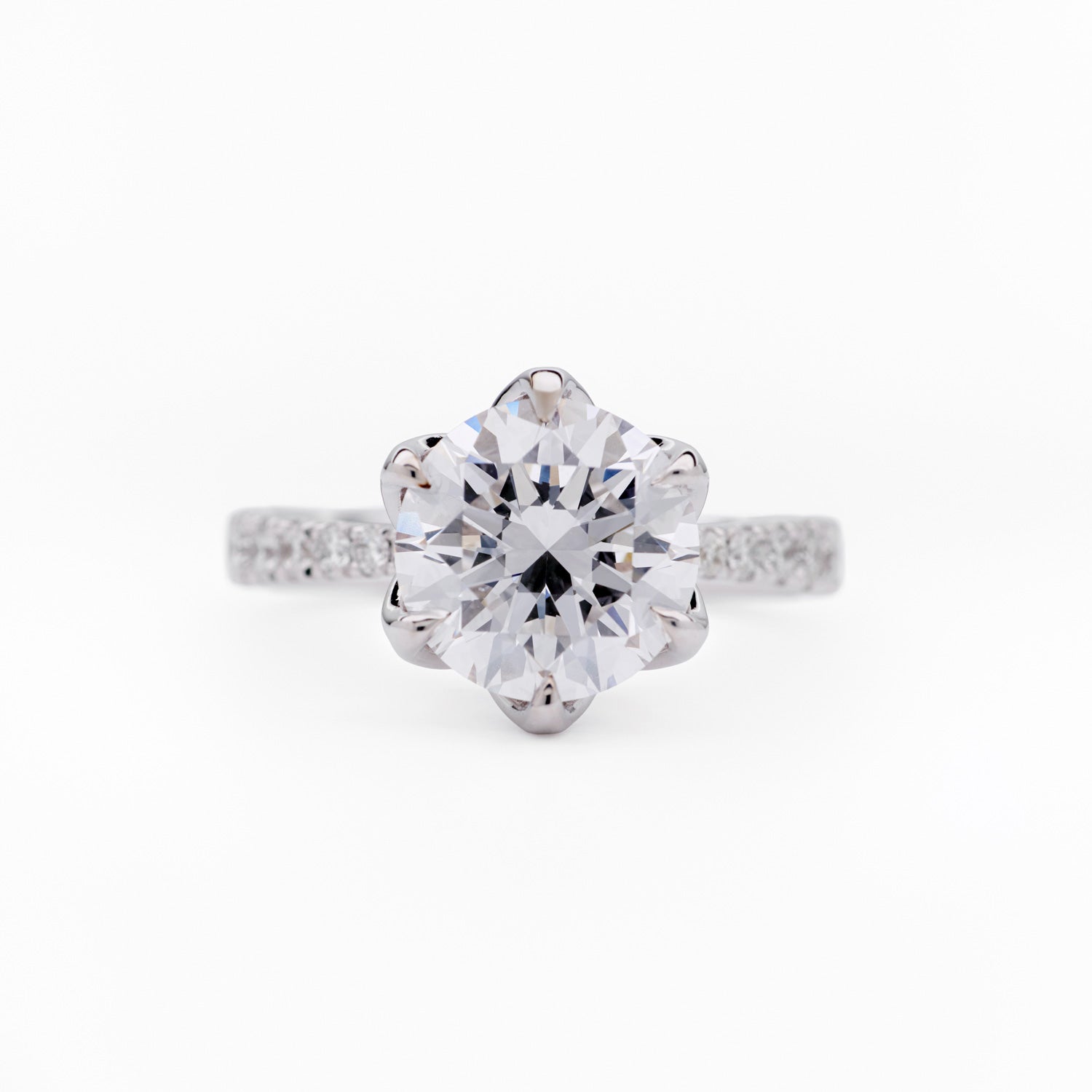 Sylvia diamond engagement ring with round brilliant-cut center stone and pavé band in white gold by Faith Jewels
