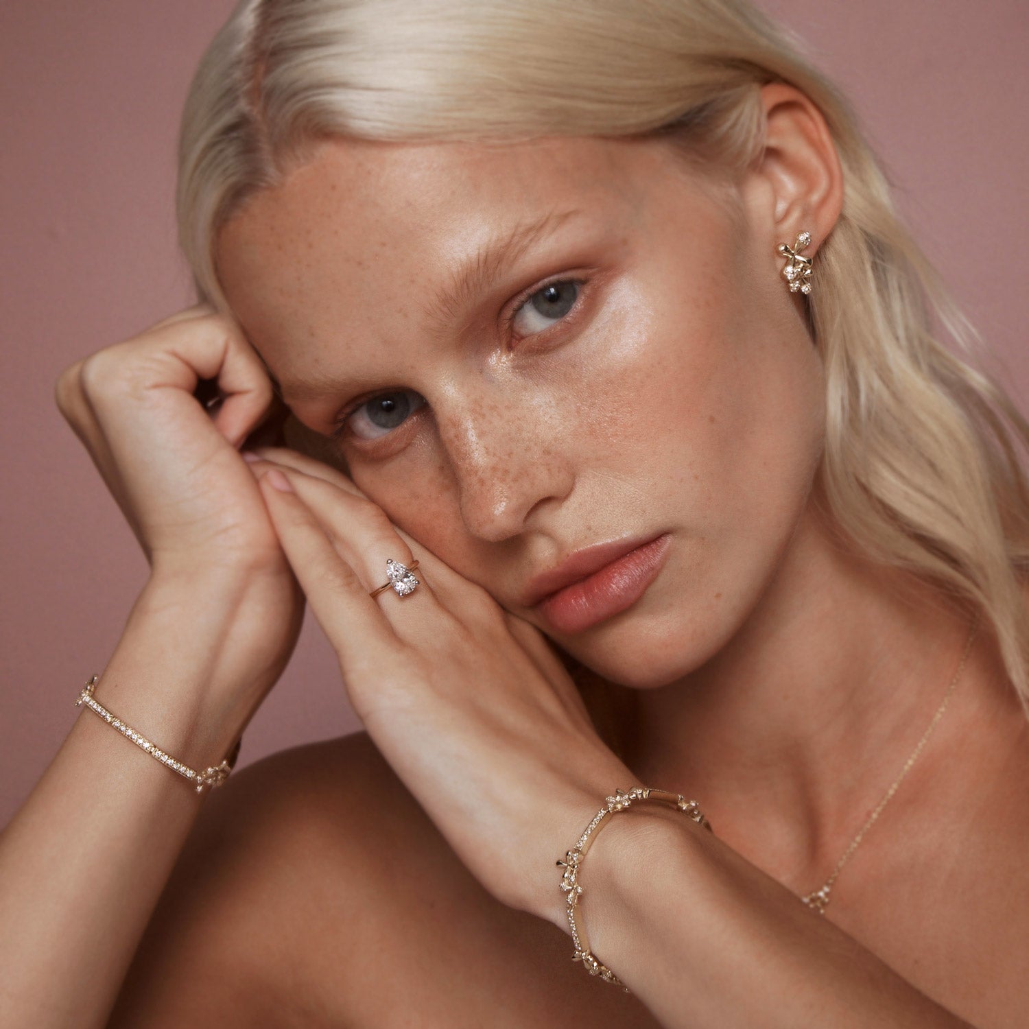 Maxi Diamond Stud Earrings in 18k yellow gold with 24 diamonds totaling 1.00ct and floral motifs, worn on model.