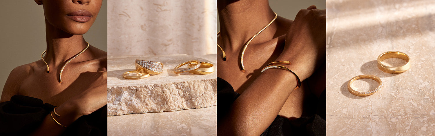 Yellow gold rings, bangle and necklace in twist design with pave diamonds on model