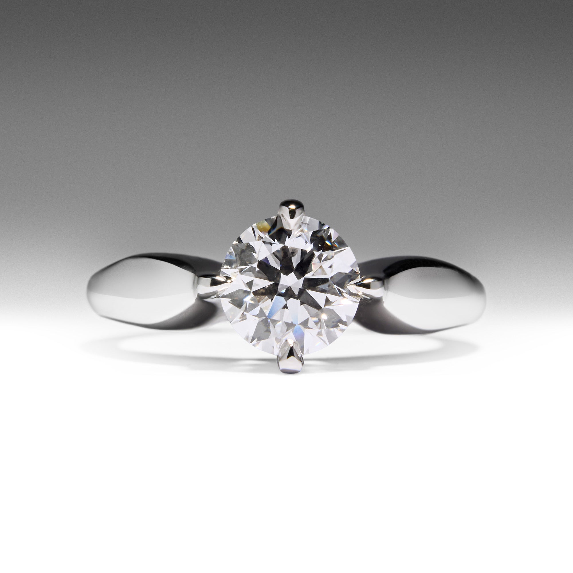 Love Today Diamond Engagement Ring in white gold with round brilliant solitaire on curved band, classic and timeless design.