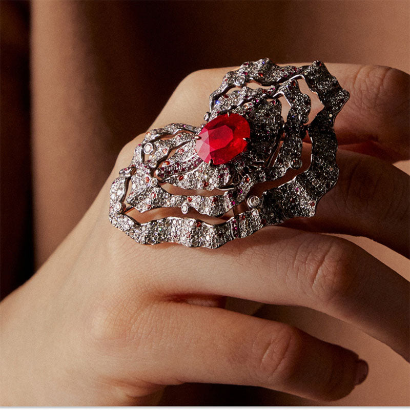 Decorative Volcano ring with a red gemstone on a hand