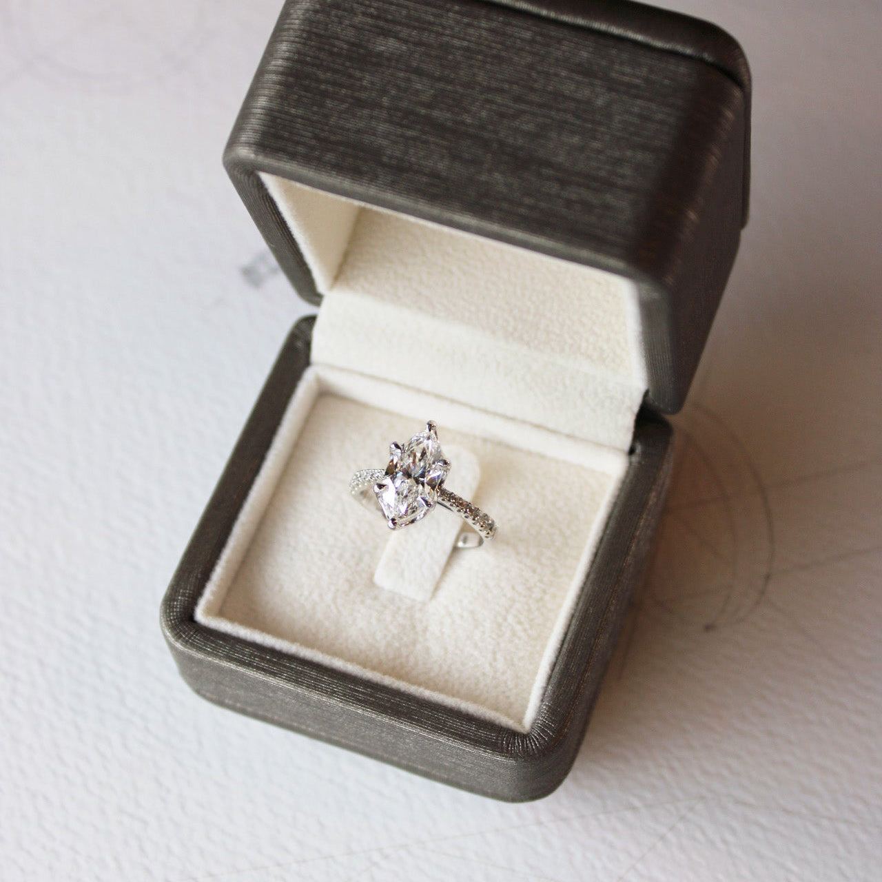 White gold bespoke marquise Toi et Moi engagement ring featuring 2ct centre diamond and precision-crafted reverse diamond.