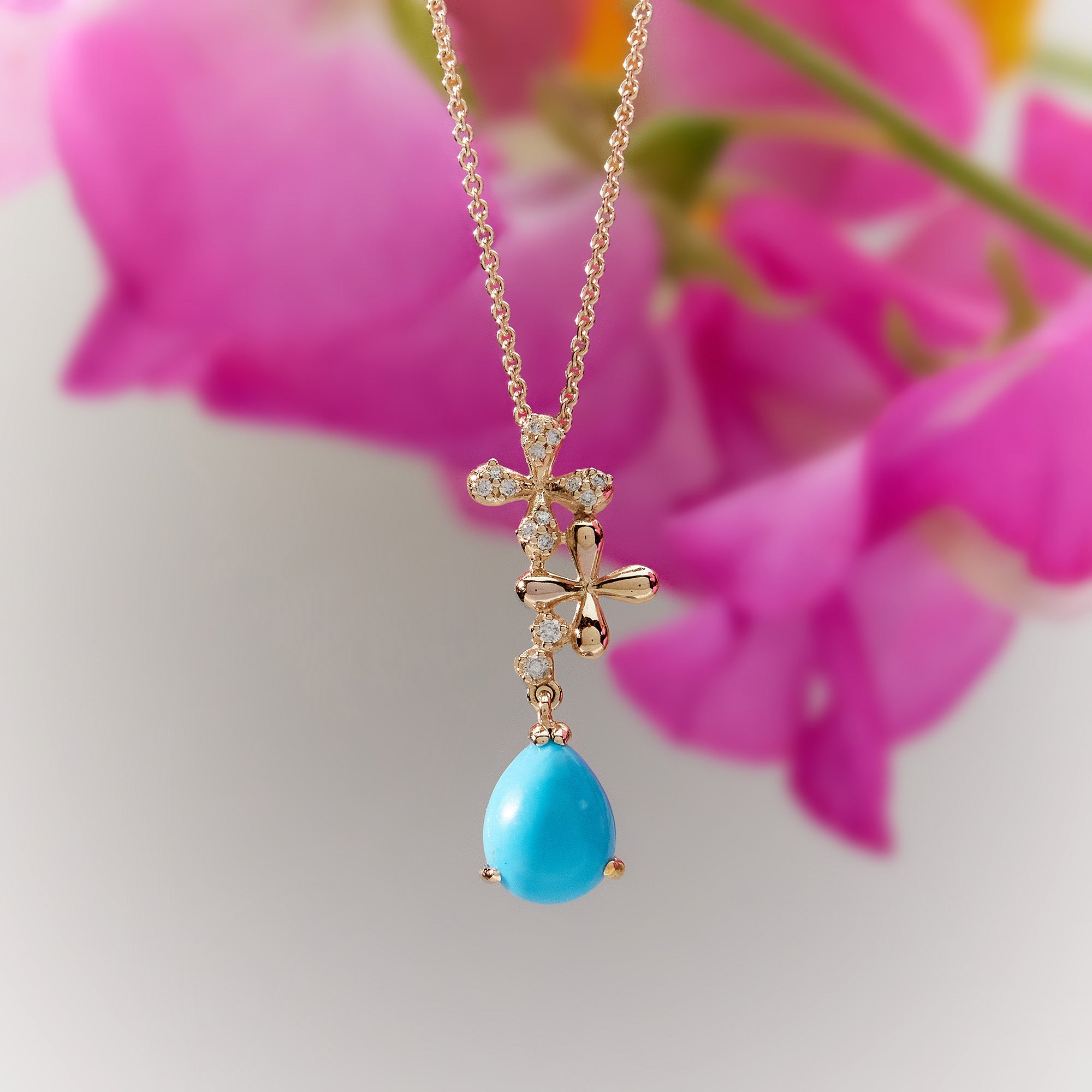 Turquoise Diamond Drop Necklace in 18k yellow gold with 0.15ct natural diamonds, hand-selected blue turquoise on adjustable 45cm trace chain.