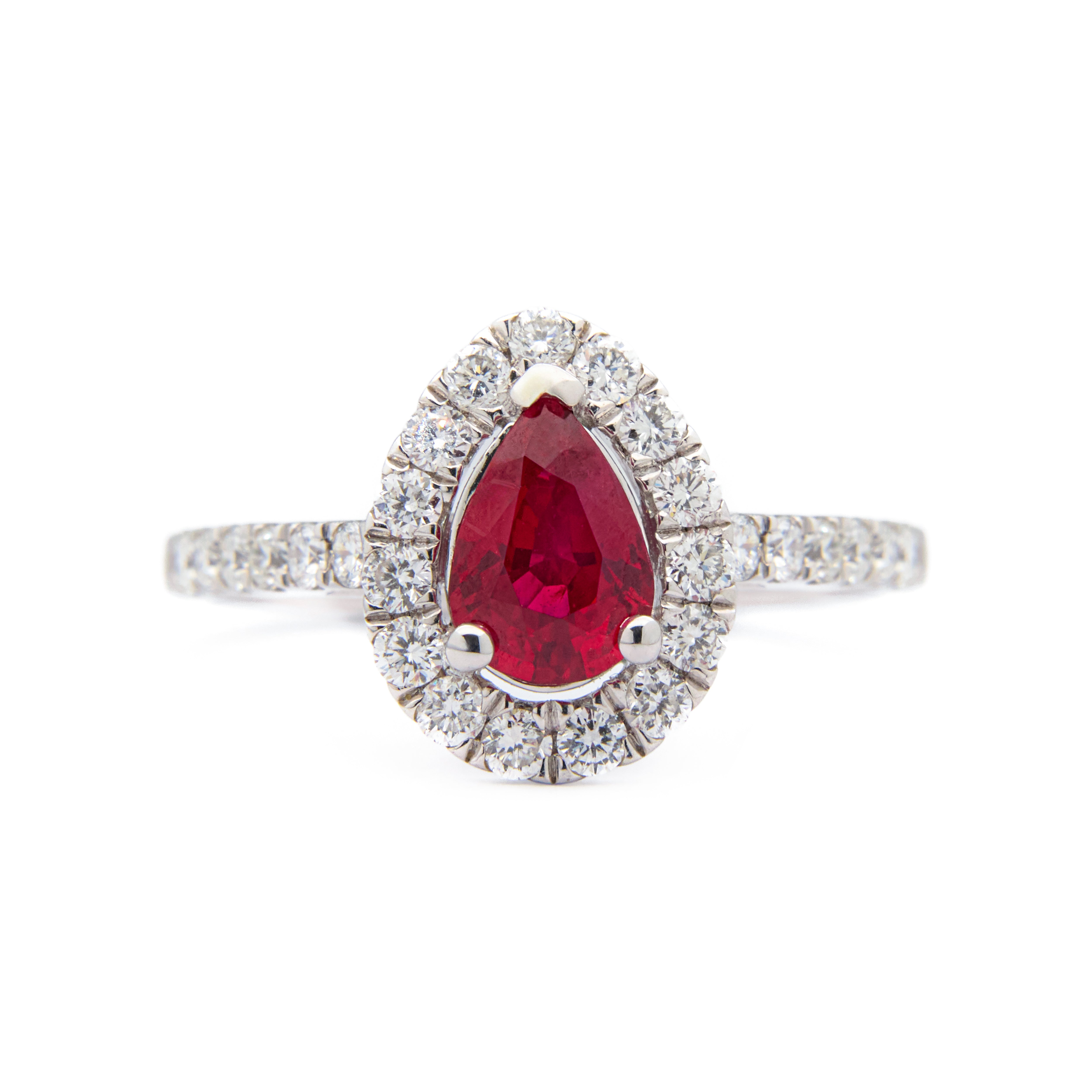 Pear-shaped ruby ring with diamond halo and shoulder accents in 18k white gold