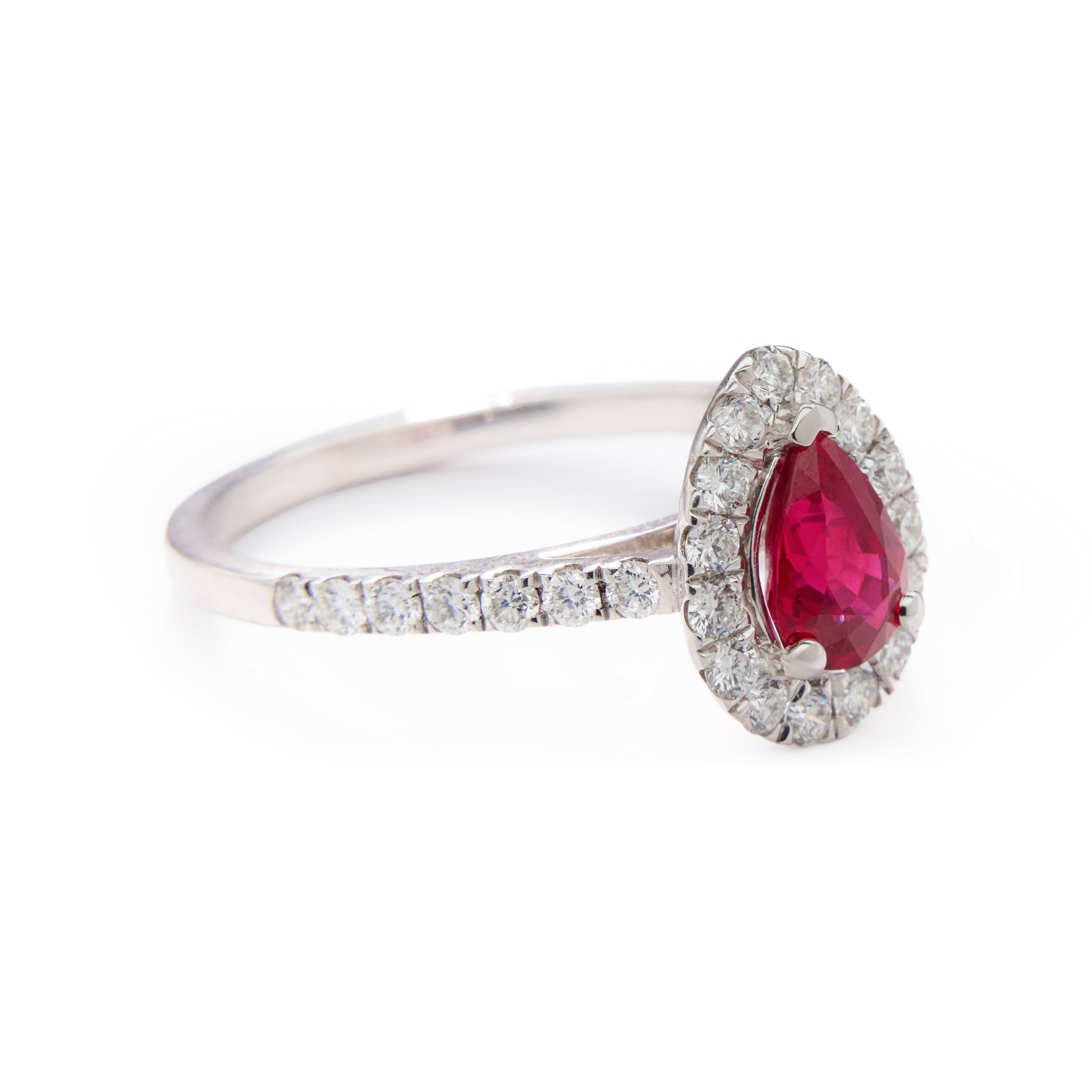 Pear-shaped ruby ring with diamond halo and shoulder accents in 18k white gold