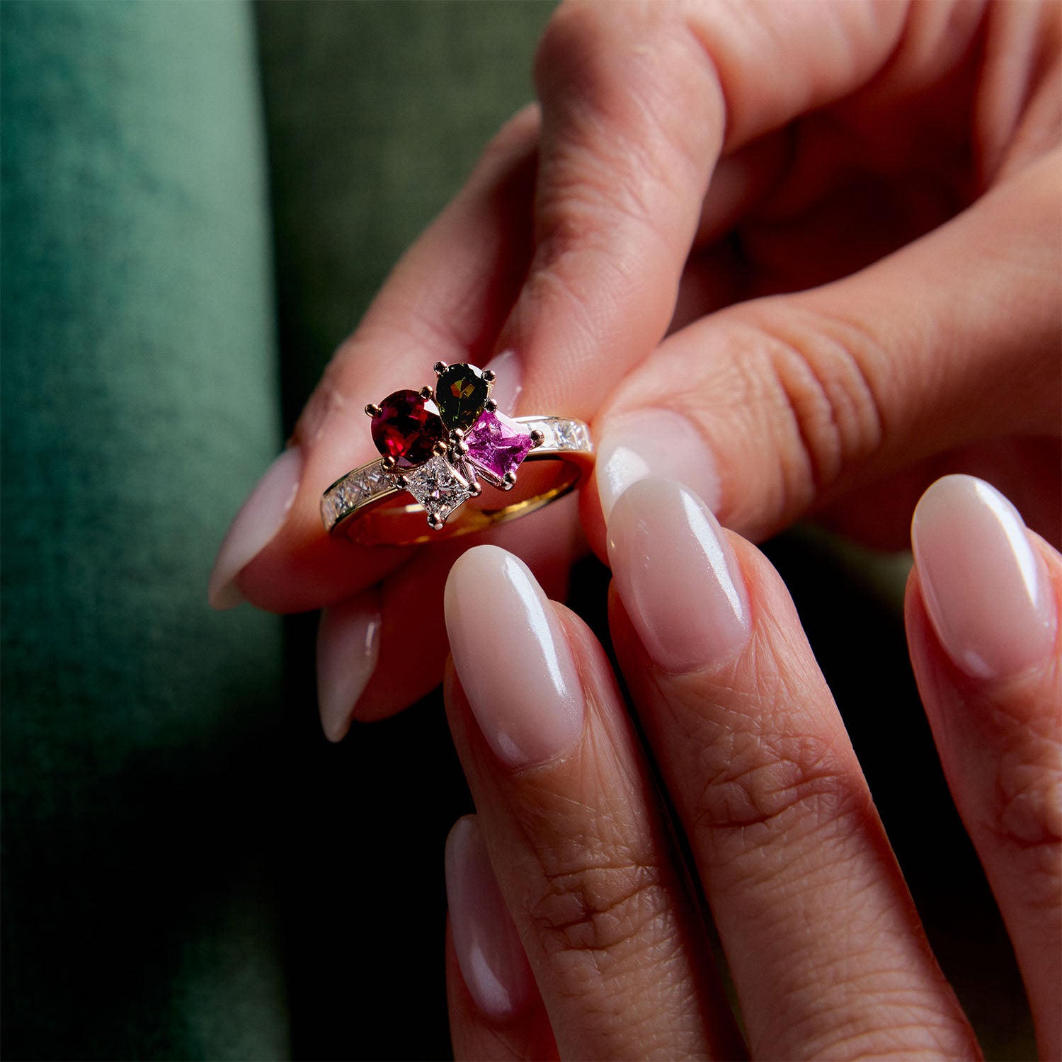 18k yellow gold ring with red ruby, pink sapphire, and green tourmaline cluster on hand