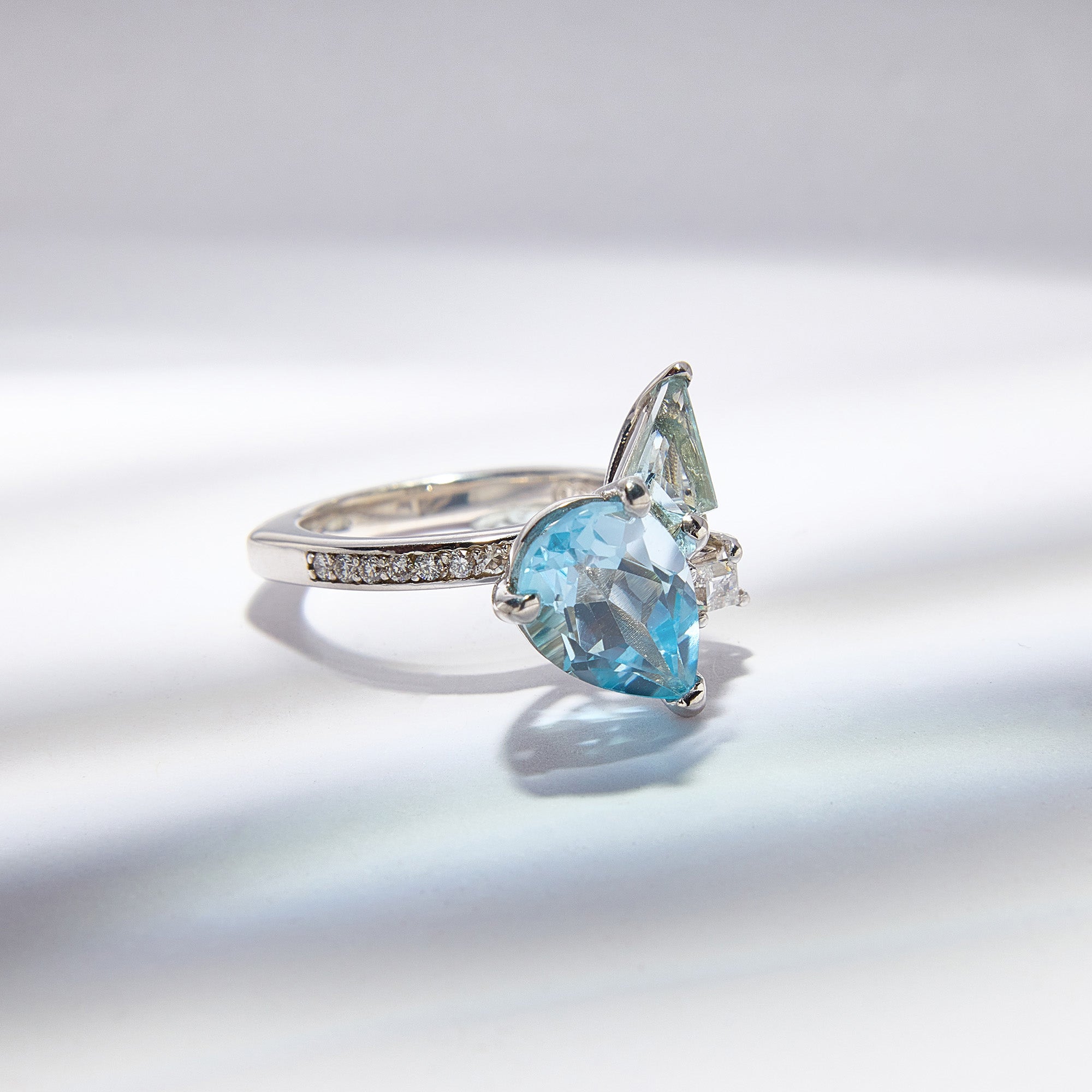 9k white gold Blue Bouquet Ring with topaz, aquamarine & diamonds, inspired by floral elegance, perfect for timeless style.