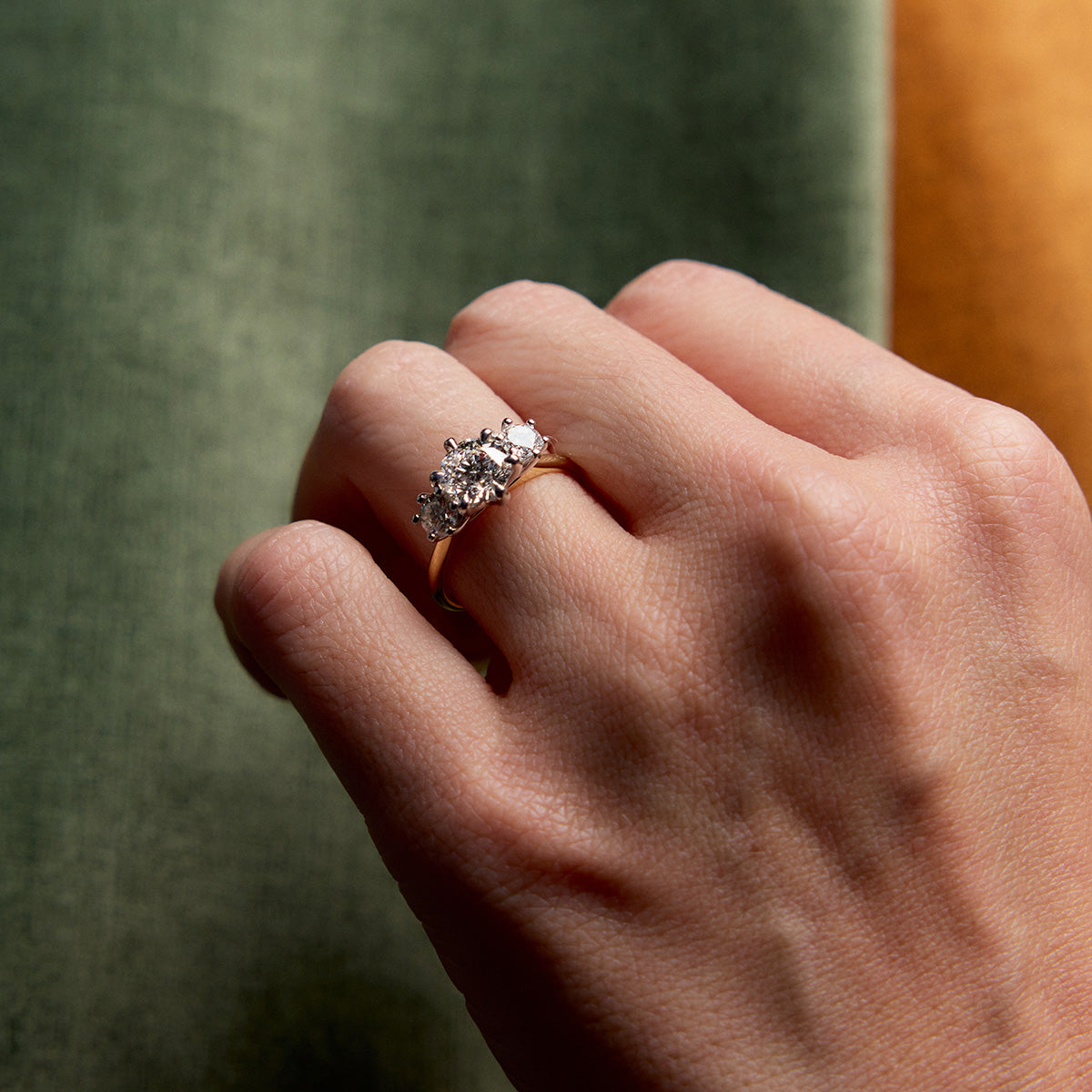 Trilogy Diamond Engagement Ring with three stones on refined band, round side diamonds, timeless elegant engagement ring design