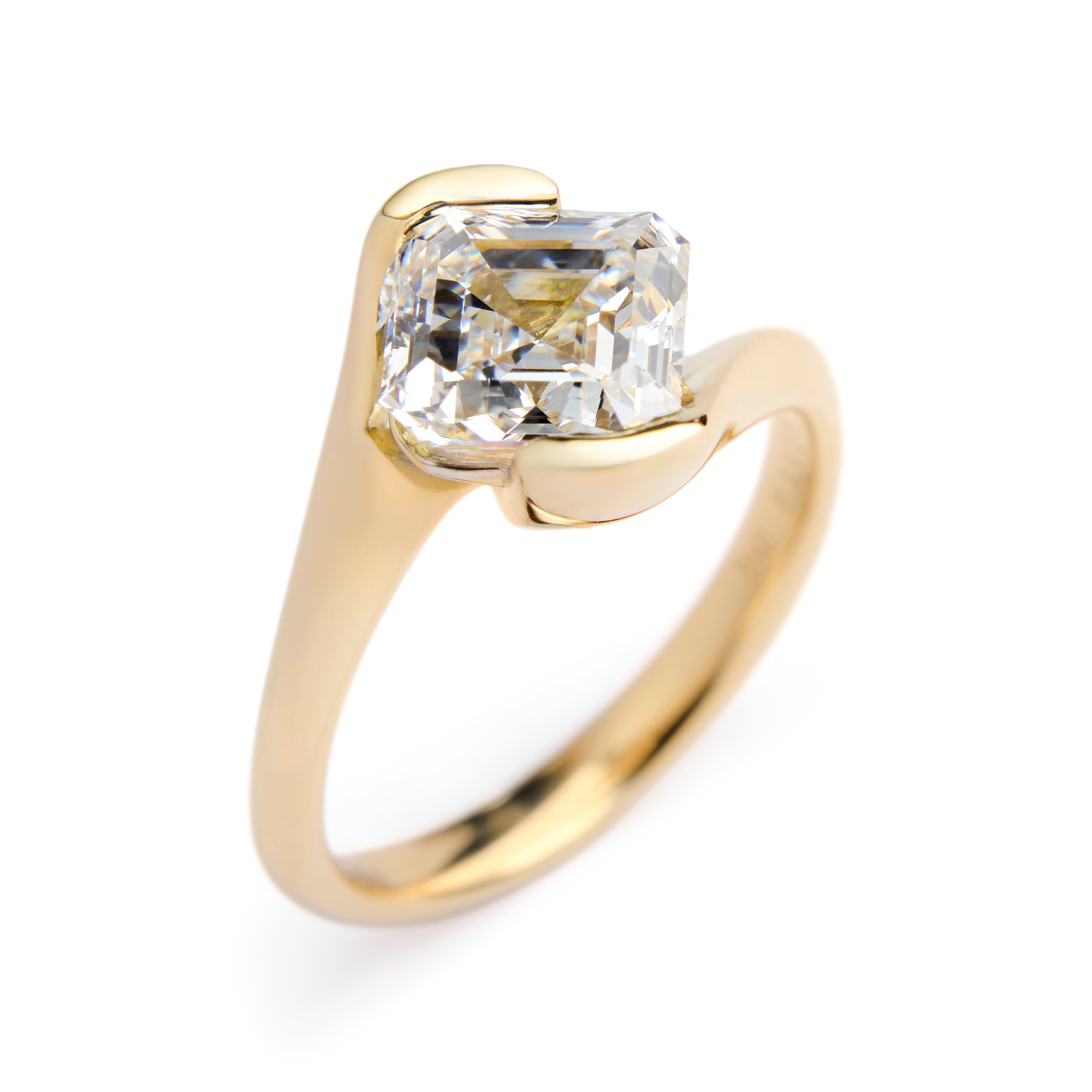 Engagement ring with asscher-cut diamond in yellow gold solitaire setting