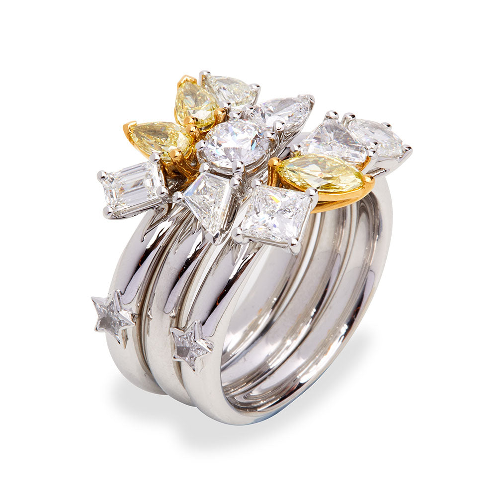 White gold Celestial Stack Ring featuring three interlocking bands set with lozenge, marquise, pear and rare star-shaped diamonds with yellow accents.