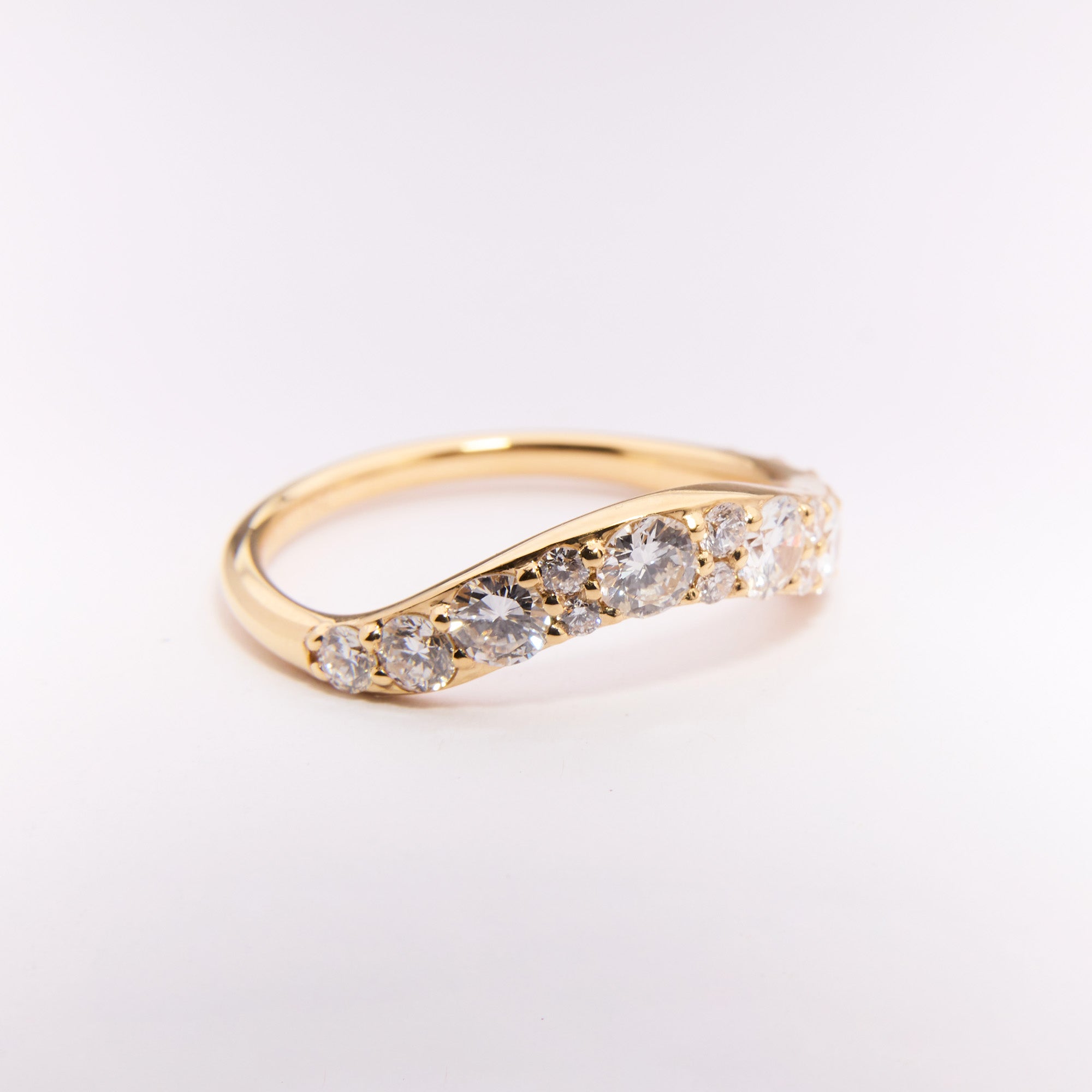 Arc Diamond Wedding Band in yellow gold, repurposed diamonds from original ring, curved design inspired by Eclipse Ring, elegant contour fit.