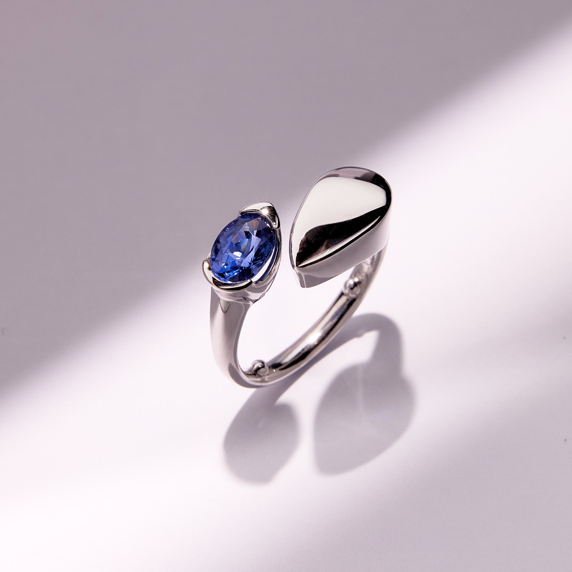Moderna Blue Sapphire Ring in 18k white gold featuring a vivid teardrop blue sapphire, sculptural tapered band and bold modern design.
