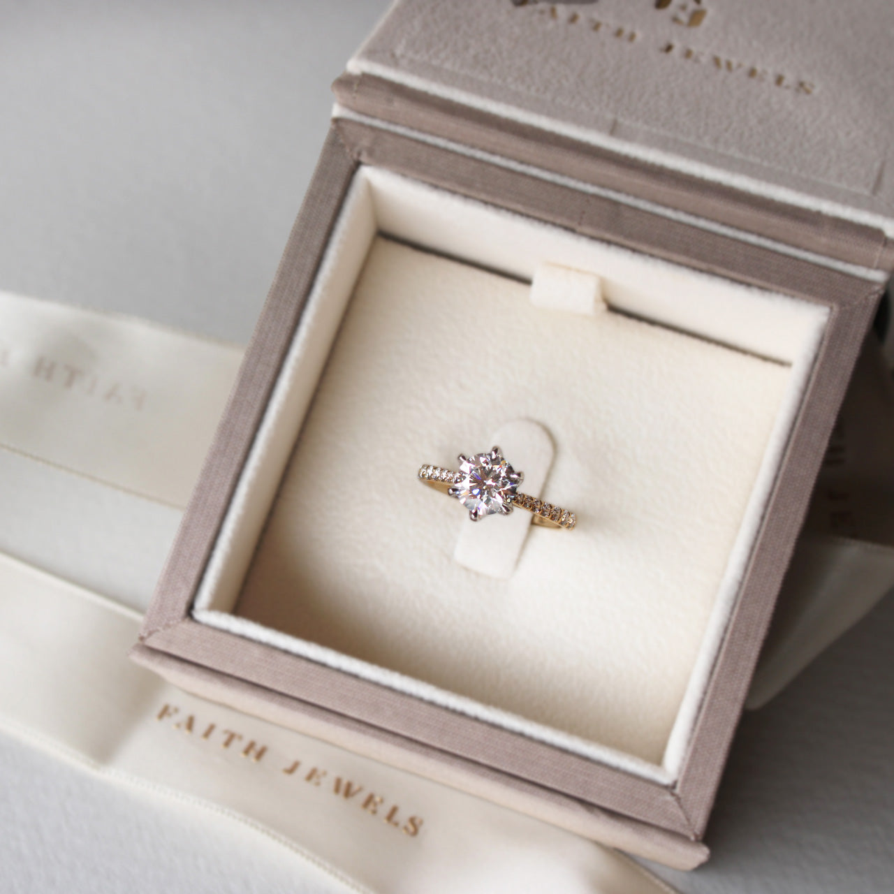 Yellow gold Clarissa solitaire engagement ring with 1.51ct diamond, pavé band, and Faith Hilda’s signature petal claw design.