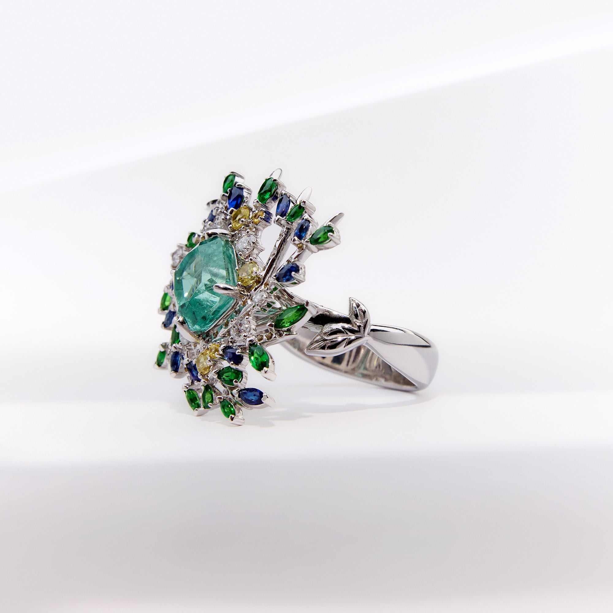 Secret garden-inspired paraiba tourmaline ring with diamonds and natural sapphires