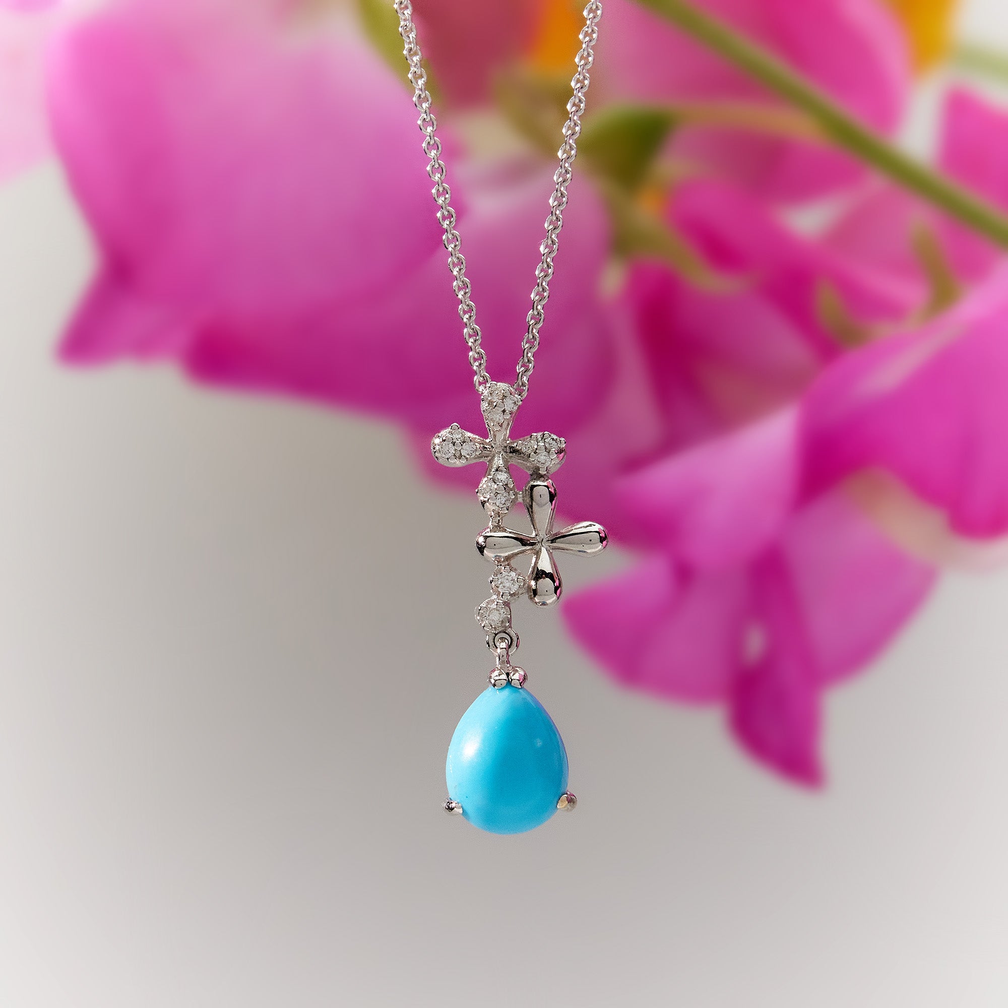 Turquoise Diamond Drop Necklace in 18k white gold with 0.15ct natural diamonds, hand-selected blue turquoise on adjustable 45cm trace chain.